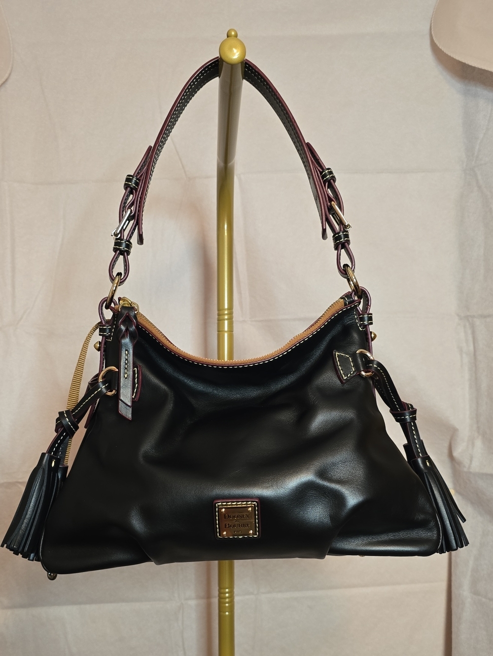 Dooney & Bourke Teagan 30 Black Leather Shoulder Bag with Tassel Accents